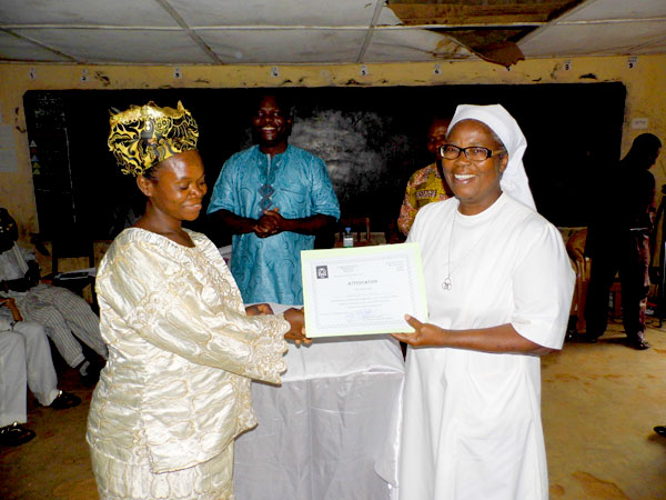 first literacy class students receiving their certificates